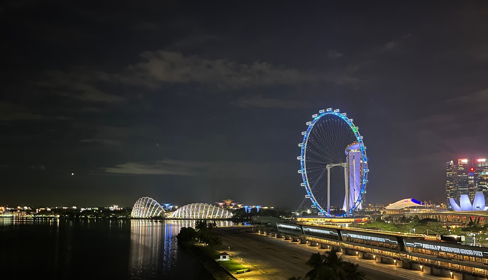 Singapore skyline at night with Marina Bay Sands and Singapore Flyer